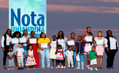 Group of women and their children in a graduation ceremony